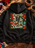 Cafecito y Chisme Flor de Navidad Hoodie Black — Flatlay creative